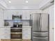 Modern kitchen equipped with stainless steel appliances and ample cabinet space at 5300 S Atlantic Ave # 14-202, New Smyrna Beach, FL 32169