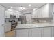 Well-lit kitchen featuring stainless steel appliances, modern cabinets, and granite countertops at 5300 S Atlantic Ave # 14-202, New Smyrna Beach, FL 32169
