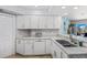 Bright kitchen with granite countertops, updated appliances, and tile backsplash at 5300 S Atlantic Ave # 14-202, New Smyrna Beach, FL 32169