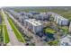 Drone image features a well-maintained condo community, pool area, and gate house entrance at 5300 S Atlantic Ave # 16-205, New Smyrna Beach, FL 32169