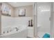 Close up of soaking tub and walk-in shower area at 5300 S Atlantic Ave # 16-205, New Smyrna Beach, FL 32169