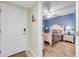 Cozy bedroom with a comfortable bed, en-suite bathroom, and hardwood floors, creating a warm and inviting space at 5300 S Atlantic Ave # 16-205, New Smyrna Beach, FL 32169