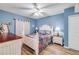 Comfortable bedroom with queen bed, white dresser and decor, and wood flooring at 5300 S Atlantic Ave # 16-205, New Smyrna Beach, FL 32169
