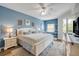 Comfortable bedroom featuring natural light, a dresser, and access to the balcony at 5300 S Atlantic Ave # 16-205, New Smyrna Beach, FL 32169