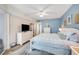 Spacious bedroom features a bed, TV, and access to an en-suite bathroom at 5300 S Atlantic Ave # 16-205, New Smyrna Beach, FL 32169