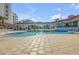 Relaxing community pool featuring a spacious deck, covered seating areas, and a refreshing atmosphere at 5300 S Atlantic Ave # 16-205, New Smyrna Beach, FL 32169