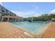 Enjoy the community pool with covered seating, waterfall feature, and inviting atmosphere for relaxation and fun at 5300 S Atlantic Ave # 16-205, New Smyrna Beach, FL 32169