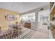 Light-filled dining area with an eat-in kitchen, breakfast bar, and stylish decor for a cozy atmosphere at 5300 S Atlantic Ave # 16-205, New Smyrna Beach, FL 32169