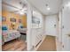 Hallway featuring a shoe storage cabinet, leading to bedrooms, creating a tidy and organized space at 5300 S Atlantic Ave # 16-205, New Smyrna Beach, FL 32169