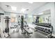 Community gym features modern exercise equipment, free weights, and a mirrored wall for effective workouts at 5300 S Atlantic Ave # 16-205, New Smyrna Beach, FL 32169