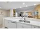 Open kitchen features a breakfast bar with views into the living area, great for entertaining at 5300 S Atlantic Ave # 16-205, New Smyrna Beach, FL 32169