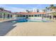 A luxurious swimming pool area with ample seating offers a resort-like experience for residents at 5300 S Atlantic Ave # 16-205, New Smyrna Beach, FL 32169