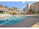 A stunning pool and spa area is surrounded by ample seating for relaxing in the sun at 5300 S Atlantic Ave # 16-205, New Smyrna Beach, FL 32169