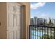 Unit 20507 balcony view overlooking tennis court with building exterior and blue skies at 5300 S Atlantic Ave # 20-507, New Smyrna Beach, FL 32169