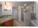 A luxurious bathroom with granite counters, an oversized shower and a soaking tub at 5300 S Atlantic Ave # 20-507, New Smyrna Beach, FL 32169