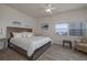 Cozy bedroom with a king size bed, and a chair with side table at 5300 S Atlantic Ave # 20-507, New Smyrna Beach, FL 32169