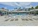 Spacious community pool with ample lounge chairs and a covered pavilion area, perfect for relaxing and socializing at 5300 S Atlantic Ave # 20-507, New Smyrna Beach, FL 32169