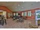 Bright community room offers comfortable seating, multiple tables, and large windows for plenty of natural light at 5300 S Atlantic Ave # 20-507, New Smyrna Beach, FL 32169