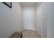 Bright entryway with neutral walls, tile flooring, closet, and entry door at 5300 S Atlantic Ave # 20-507, New Smyrna Beach, FL 32169