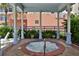 Community hot tub under a gazebo featuring lush greenery at 5300 S Atlantic Ave # 20-507, New Smyrna Beach, FL 32169