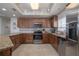Beautiful kitchen with stainless steel appliances, tile backsplash and granite countertops at 5300 S Atlantic Ave # 20-507, New Smyrna Beach, FL 32169