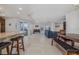 Spacious living room with tile floors, wet bar, a dining area and balcony access at 5300 S Atlantic Ave # 20-507, New Smyrna Beach, FL 32169