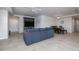 Open-concept living and dining area featuring tile floors, stylish furniture, and ceiling fan at 5300 S Atlantic Ave # 20-507, New Smyrna Beach, FL 32169