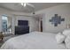 The primary suite features a large bed, dresser with tv, and ensuite bathroom at 5300 S Atlantic Ave # 20-507, New Smyrna Beach, FL 32169