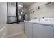 Utility room with laundry machines and a water heater at 5300 S Atlantic Ave # 20-507, New Smyrna Beach, FL 32169