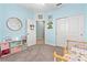Charming bedroom with soft blue walls and decor plus easy access to other rooms at 5607 Estero Loop, Port Orange, FL 32128