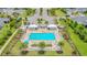Overhead shot of the Westport community pool, complete with lounge chairs and palm trees, inviting relaxation at 5607 Estero Loop, Port Orange, FL 32128