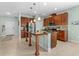 An alternate view of the kitchen with a granite island and stainless steel appliances at 5607 Estero Loop, Port Orange, FL 32128
