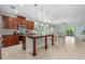 Spacious kitchen with dark wood cabinets, granite countertops, and stainless steel appliances at 5607 Estero Loop, Port Orange, FL 32128