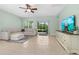 Comfortable living room with tile flooring, modern furnishings, and access to the outdoor patio at 5607 Estero Loop, Port Orange, FL 32128
