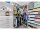 Custom walk-in closet offers ample storage with shelves, drawers, and hanging space for organized wardrobe management at 5607 Estero Loop, Port Orange, FL 32128