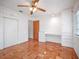 Bedroom highlighting hardwood floors, a built-in desk, and a ceiling fan for added comfort at 600 Magnolia St, New Smyrna Beach, FL 32168