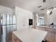 Bright kitchen featuring stainless steel appliances, an island, and black and white tile flooring at 600 Magnolia St, New Smyrna Beach, FL 32168