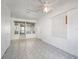 Sunroom with tiled flooring, bright natural light, and built-in storage solutions at 600 Magnolia St, New Smyrna Beach, FL 32168
