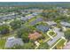 Bird's-eye view showing neighborhood with waterfront homes and lush greenery at 6093 Sabal Creek Blvd, Port Orange, FL 32128