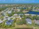 Scenic aerial view of a peaceful neighborhood featuring houses near waterways and lush greenery at 6093 Sabal Creek Blvd, Port Orange, FL 32128