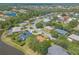 High-angle aerial of a community with well-maintained streets and homes with picturesque water views at 6093 Sabal Creek Blvd, Port Orange, FL 32128