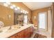 Bathroom with double sinks and stylish lighting for a relaxing experience at 6093 Sabal Creek Blvd, Port Orange, FL 32128