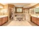 Luxurious bathroom features dual vanities, soaking tub, a walk-in shower, and stylish tile flooring at 6093 Sabal Creek Blvd, Port Orange, FL 32128