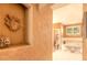 Luxurious bathroom with decorative details leading to a tub and toilet area at 6093 Sabal Creek Blvd, Port Orange, FL 32128