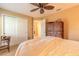 Cozy bedroom with a ceiling fan, window and closet space perfect for relaxation at 6093 Sabal Creek Blvd, Port Orange, FL 32128