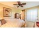 Comfortable bedroom with ceiling fan and closet space, perfect for relaxation at 6093 Sabal Creek Blvd, Port Orange, FL 32128