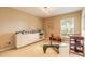 Bonus room filled with natural light from the large window, modern lighting and carpeted floors at 6093 Sabal Creek Blvd, Port Orange, FL 32128
