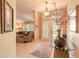 Inviting entryway featuring a glass-topped table, elegant decor, and a glimpse into the living room at 6093 Sabal Creek Blvd, Port Orange, FL 32128