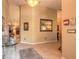 Bright foyer with tile floors, glass table, and decorative mirror at 6093 Sabal Creek Blvd, Port Orange, FL 32128