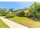 Inviting single-Gathering home featuring manicured landscaping, a lush lawn, and a charming facade at 6093 Sabal Creek Blvd, Port Orange, FL 32128